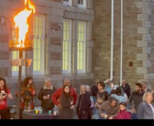 Crowds around lit beacon